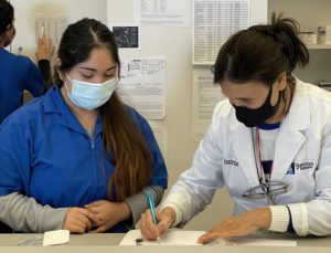 Instructor reviews student work